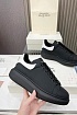 Кожаные кроссовки Alexander McQueen чёрного цвета
