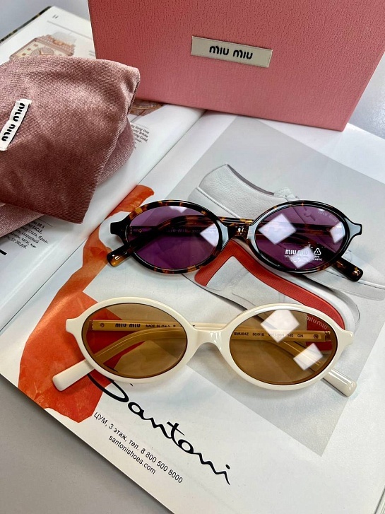 Солнцезащитные очки MIU MIU с леопардовой оправой