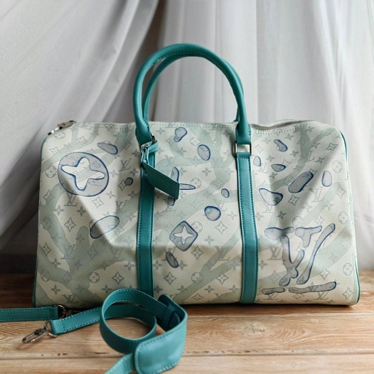 Кожаная дорожная сумка Louis Vuitton Discovery Keepall Monogram 45x27 см   