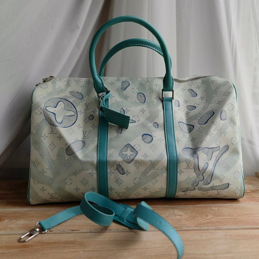 Кожаная дорожная сумка Louis Vuitton Discovery Keepall Monogram 45x27 см   