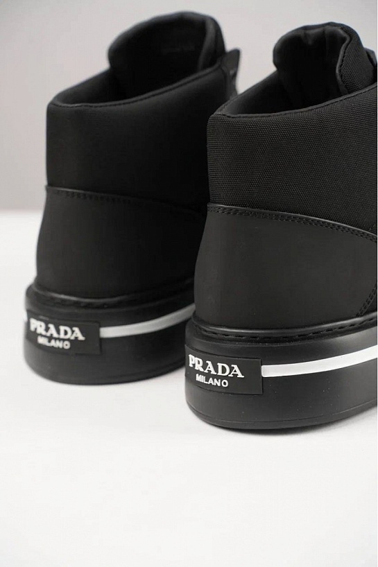 Комбинированные кроссовки с мехом Prada