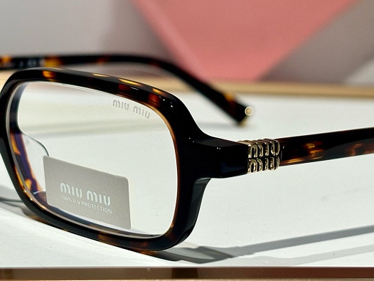 Женские очки MIU MIU с леопардовой оправой   