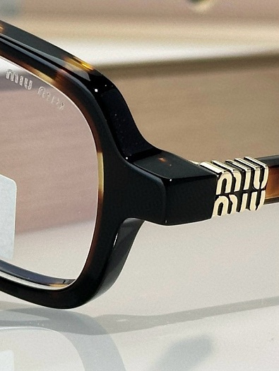 Женские очки MIU MIU с леопардовой оправой   