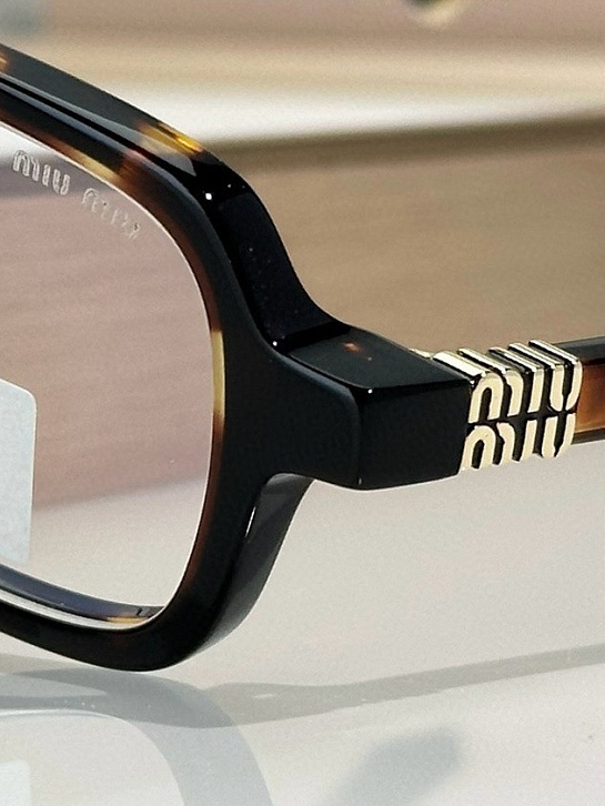 Женские очки MIU MIU с леопардовой оправой