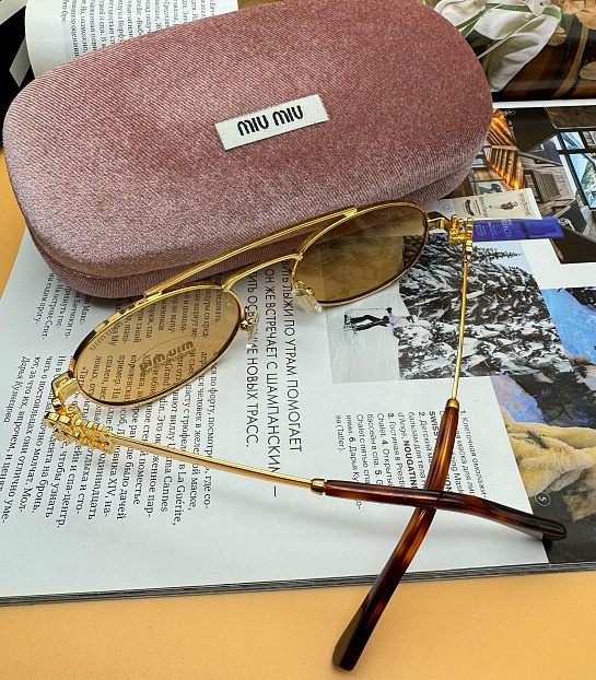 Женские солнцезащитные очки MIU MIU Oval