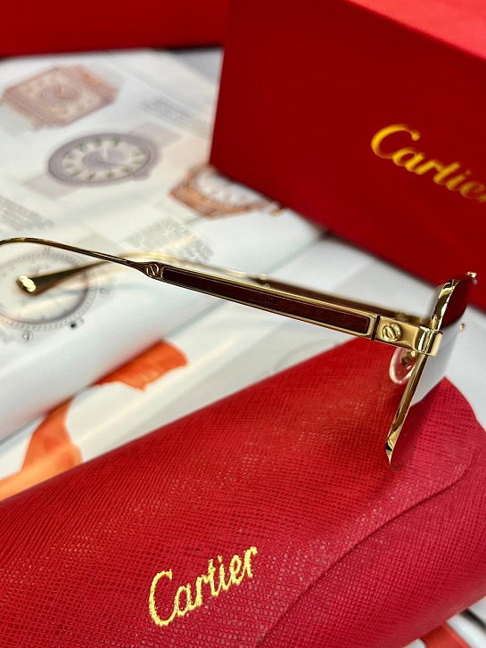 Солнцезащитные очки Cartier с коричневыми линзами