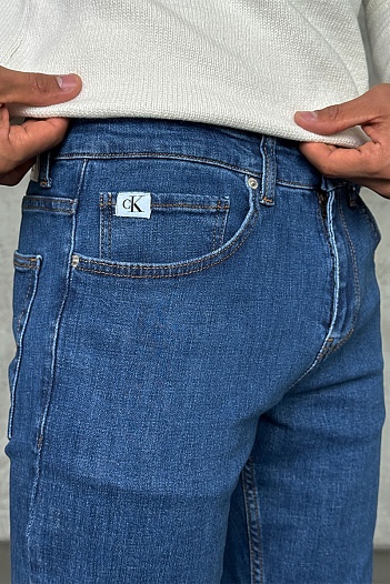 Джинсы синего цвета Calvin Klein   