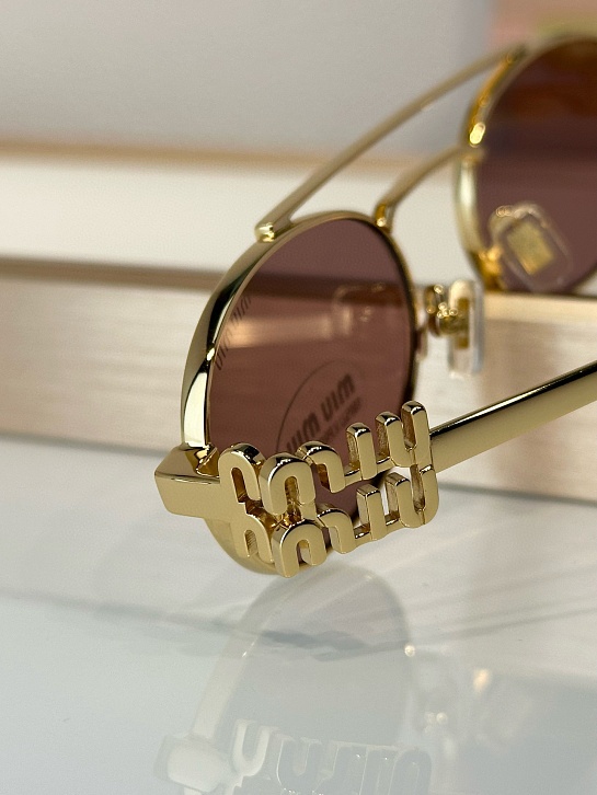 Женские солнцезащитные очки MIU MIU Oval