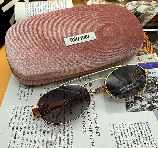 Женские солнцезащитные очки MIU MIU Oval