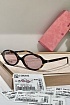 Солнцезащитные очки MIU MIU с леопардовой оправой