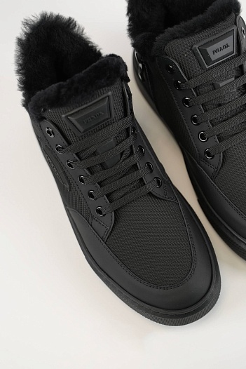 Комбинированные кроссовки с мехом Prada   