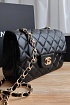 Кожаная чёрная сумка Chanel 25x15 см