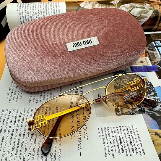 Женские солнцезащитные очки MIU MIU Oval