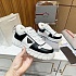 Кожаные кроссовки с мехом Prada