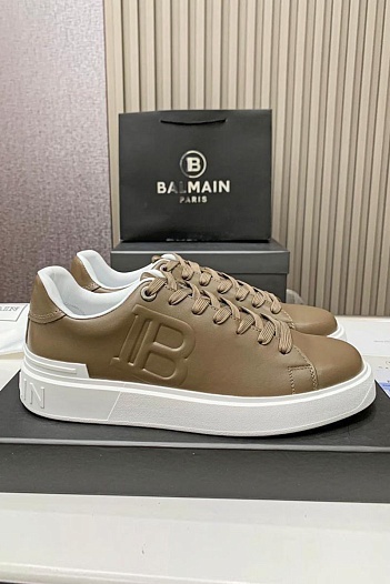 Кожаные кроссовки Balmain бежевого цвета   