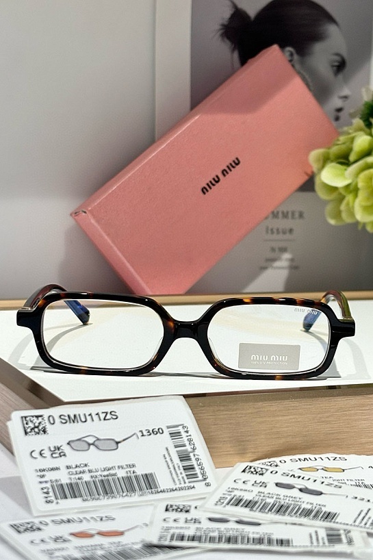 Женские очки MIU MIU с леопардовой оправой