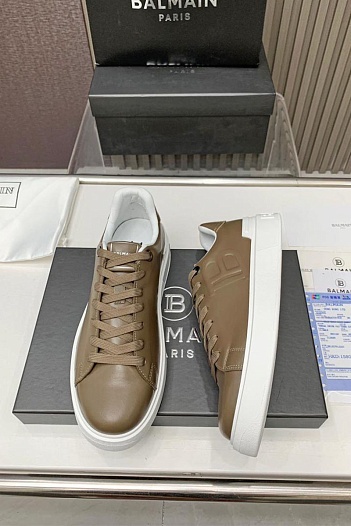 Кожаные кроссовки Balmain бежевого цвета   