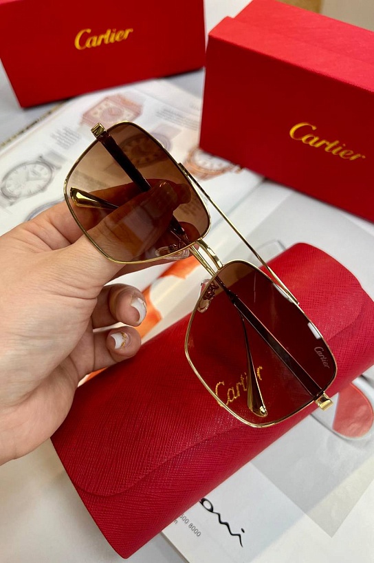 Солнцезащитные очки Cartier с коричневыми линзами