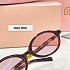 Солнцезащитные очки MIU MIU с леопардовой оправой