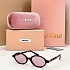 Солнцезащитные очки MIU MIU с леопардовой оправой