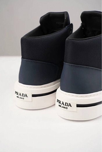 Комбинированные кроссовки с мехом Prada   